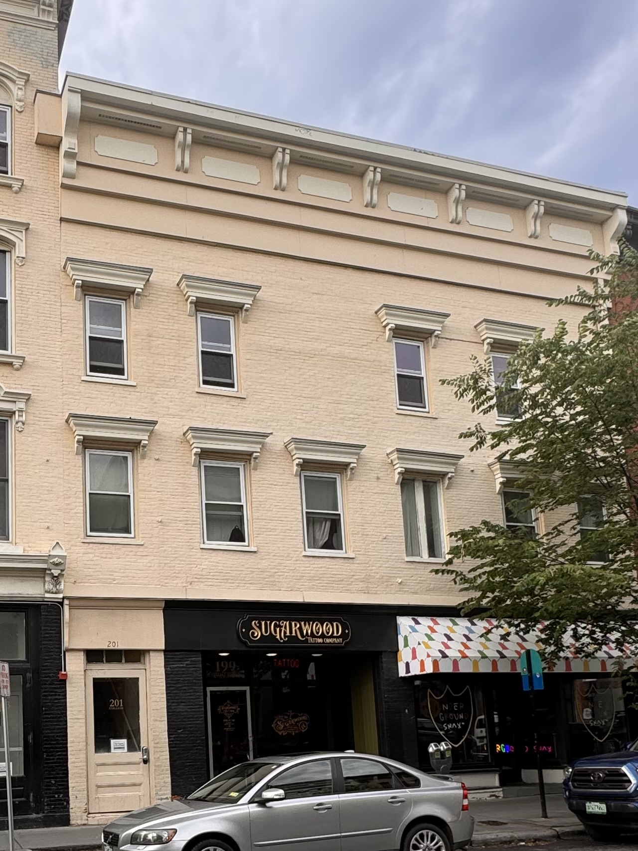 Tan brick building before restoration
